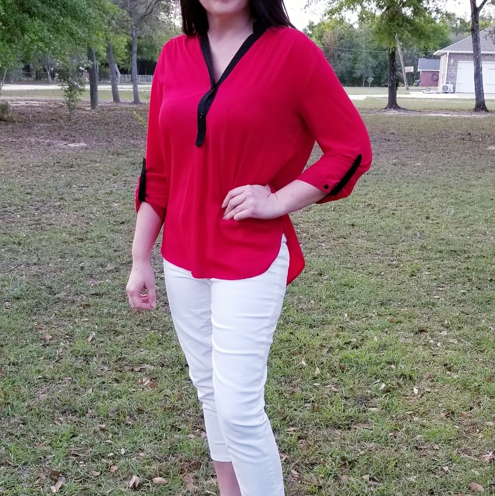 Red 3 quarter length sleeve blouse, black trim